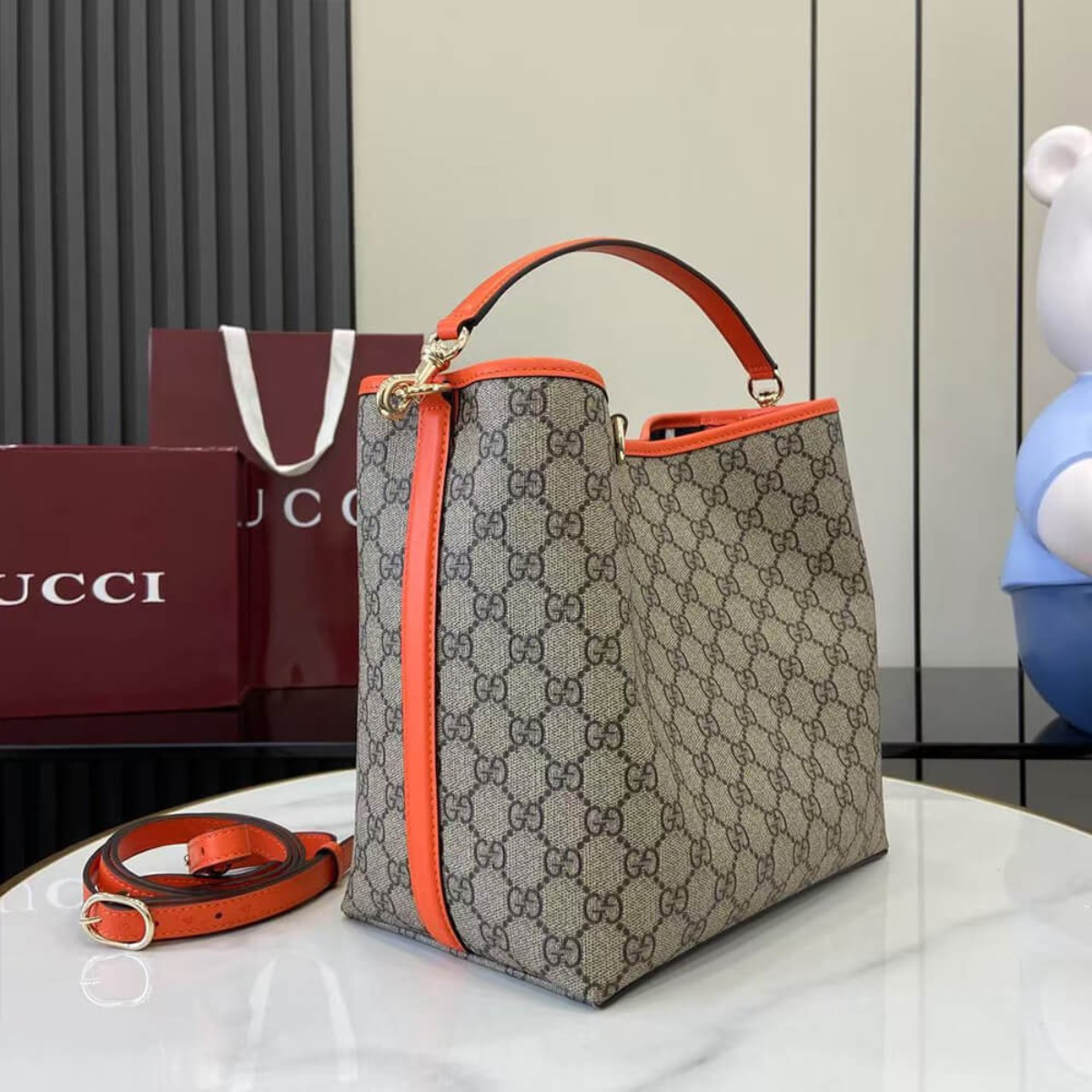 MEDIUM GG EMBLEM BUCKET BAG GUCCI