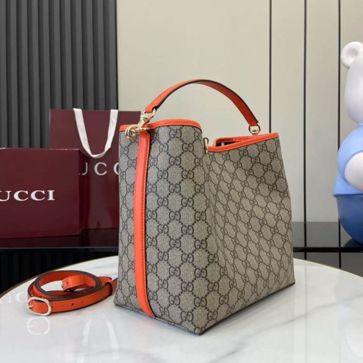 MEDIUM GG EMBLEM BUCKET BAG GUCCI